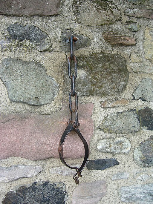 A photograph of jougs attached to the wall of Duddingston Kirk.